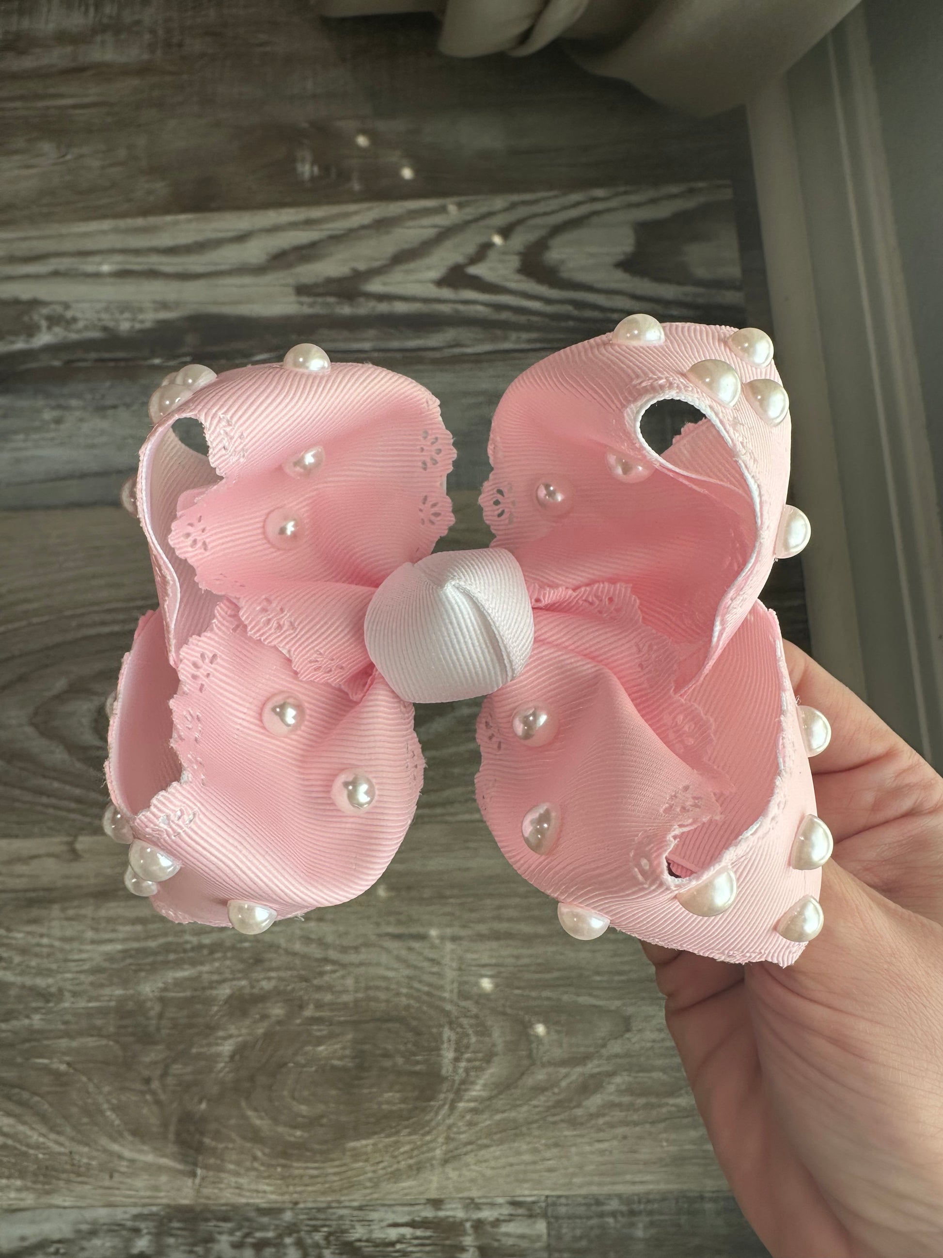 Pink lace-trimmed bow with hand-placed pearls, called Pearl Princess, boutique handmade hair bow