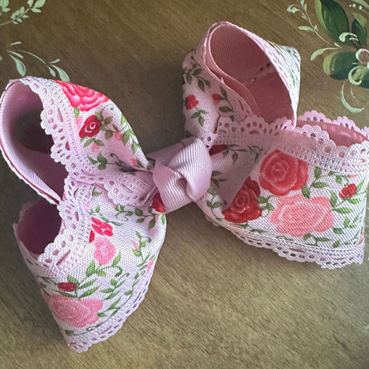 Handmade blush pink floral bow with vintage bouquet print | boutique girls’ hair accessory by The Britt Bow Co.