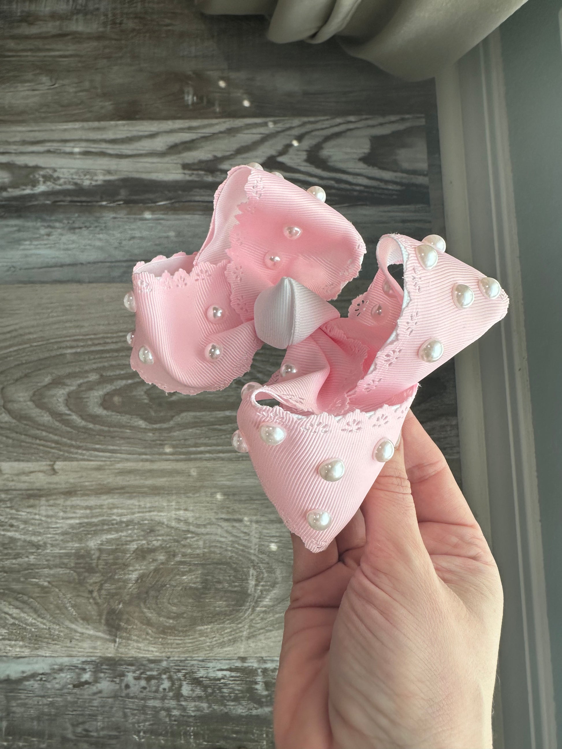 Pink lace-trimmed bow with hand-placed pearls, called Pearl Princess, boutique handmade hair bow