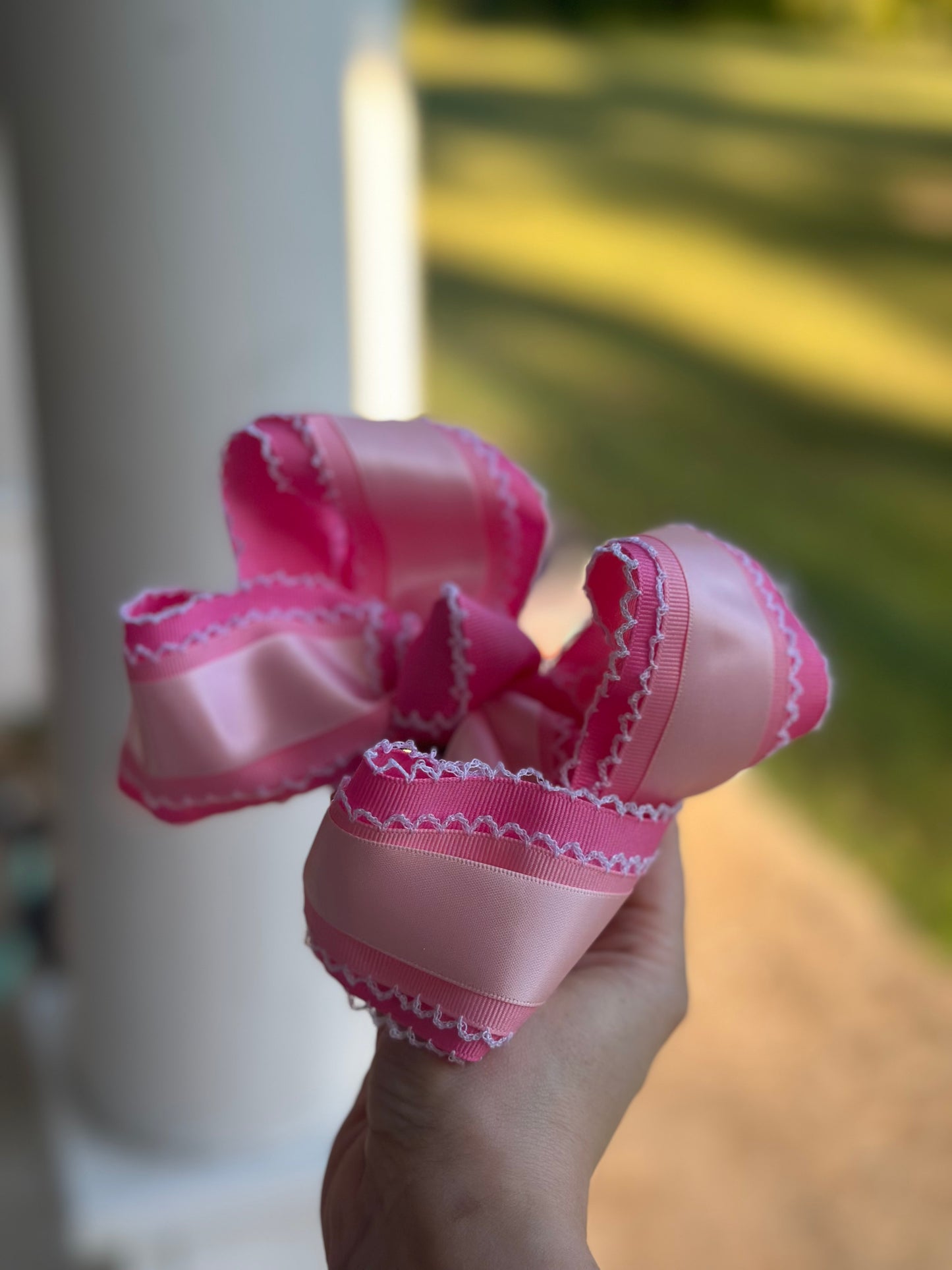 Pink awareness bow for girls with layered ribbons and boutique scalloped detail